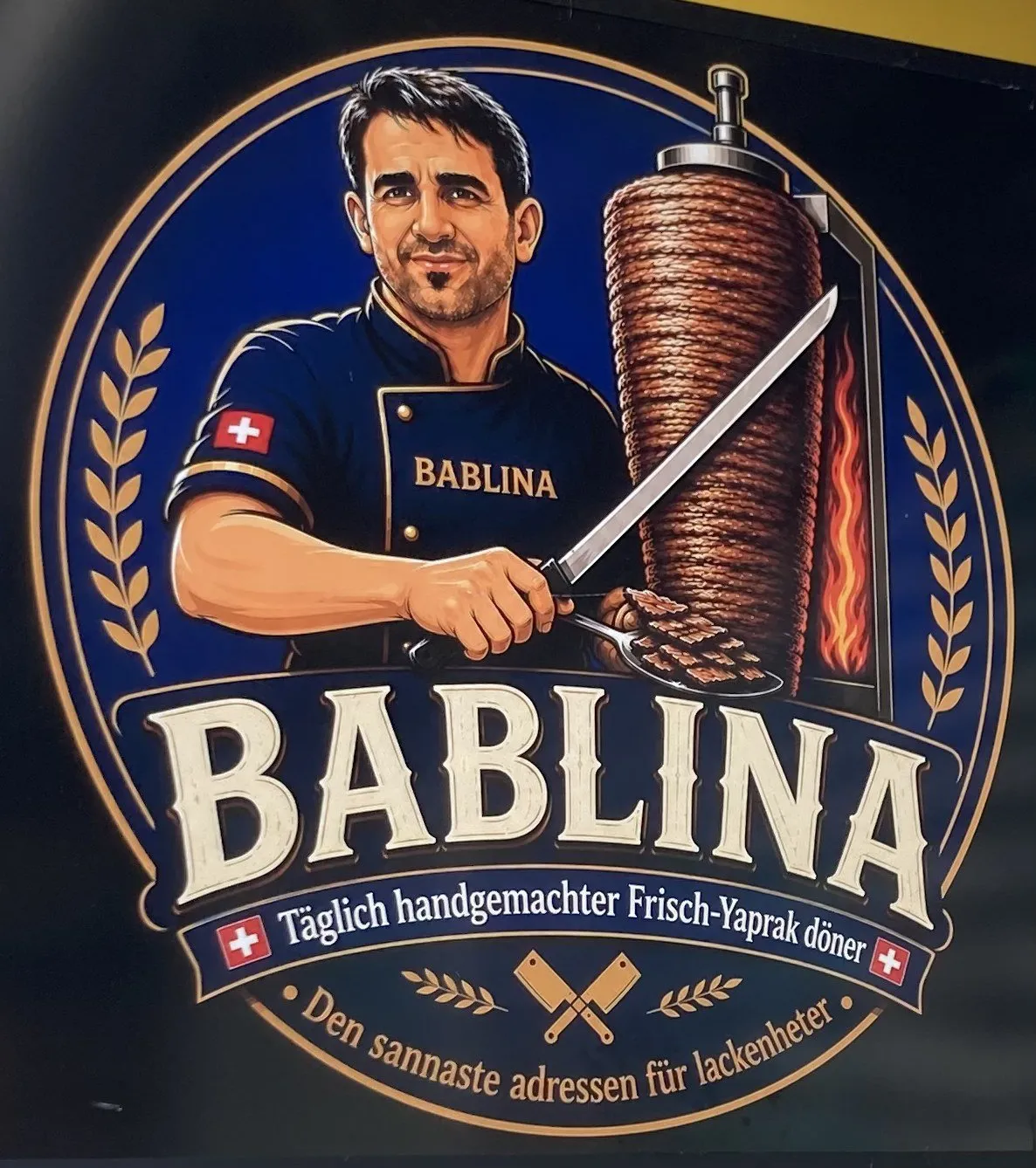 Das Bablina-Logo mit Döner-Meister am Drehspiess